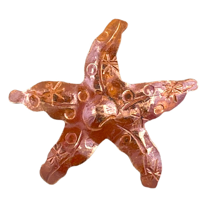 Handcrafted copper starfish pendant with flame-torched finish and stamped details