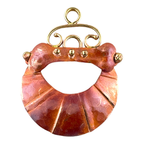 Handcrafted copper and brass crescent dog bone component with red flame patina, designed by Patricia Healey for pet-themed jewelry