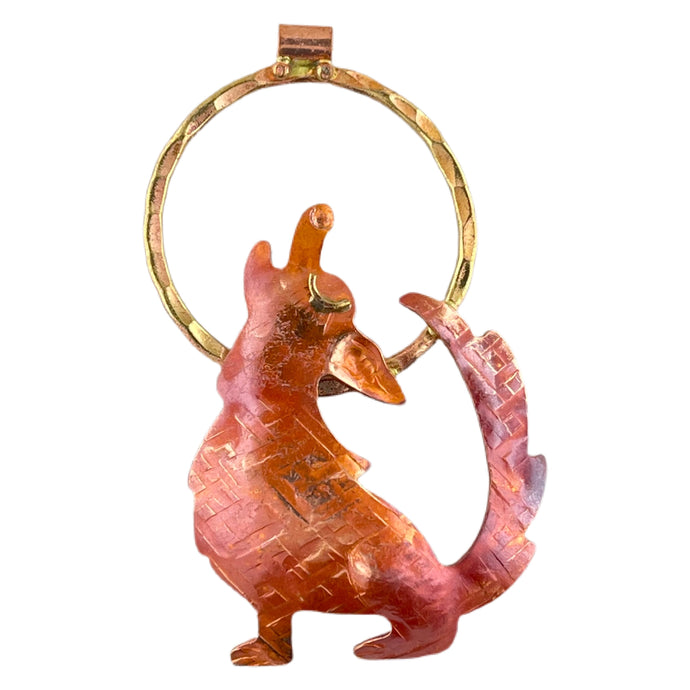 Handmade copper and brass coyote pendant howling at the moon with red patina, by Patricia Healey