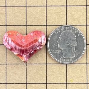 Medium Puffy Heart with Border of Bumps/Lines in Middle-String Top to Bottom