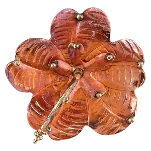 Handmade copper hibiscus flower pendant with repoussé petals, hand-stamped texture, brass stamen, and red-orange torch-fired patina by Patricia Healey