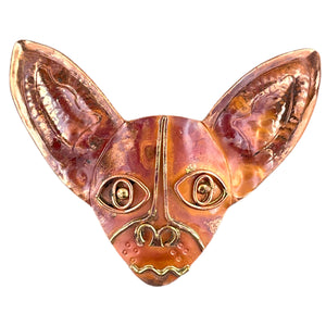 Handcrafted copper Chihuahua pendant with brass detail and red flame patina, designed by Patricia Healey for animal lovers and bold jewelry