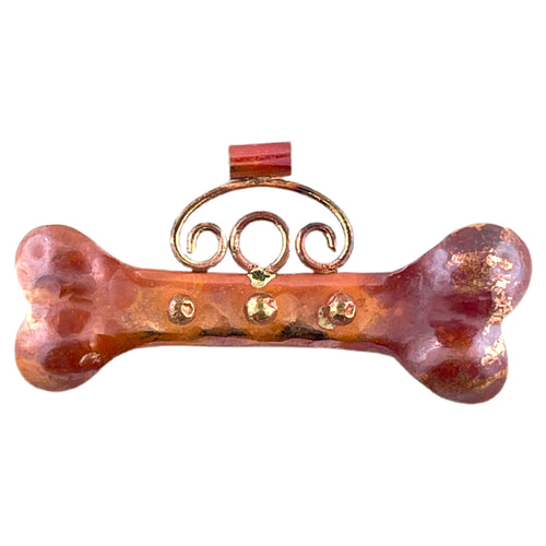 Handcrafted large copper dog bone pendant with brass accents and red flame patina, designed by Patricia Healey for pet lovers and rustic jewelry