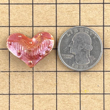 Medium Puffy Heart with Border of Bumps/Lines in Middle-String Side to Side