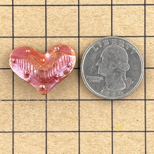 Medium Puffy Heart with Border of Bumps/Lines in Middle-String Side to Side