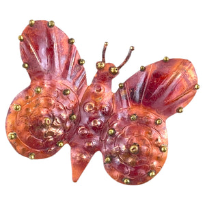 Handmade copper and brass butterfly pendant with angled bail, flame-patinated finish, and brass ball accents
