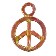 Small handcrafted copper peace sign charm with bronze solder detail and flame-fired red-orange patina, by Patricia Healey.
