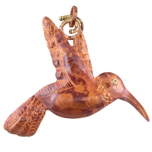 Large handmade copper and brass hummingbird pendant with hand-stamped texture and warm patina