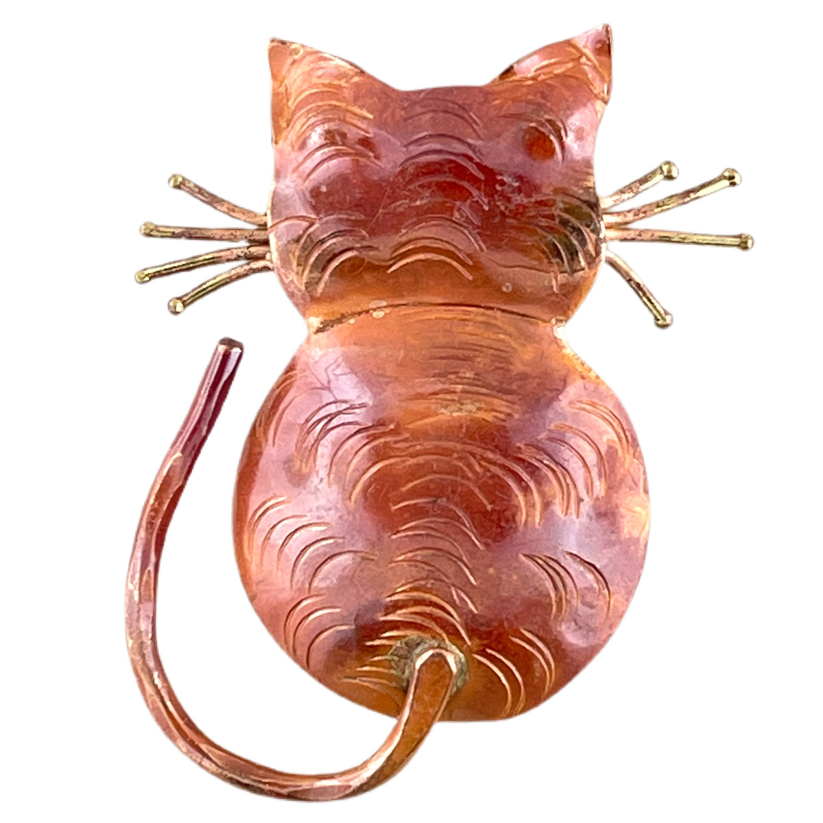 Handcrafted copper cat pendant with back-turned pose, brass whiskers, and flame-finished red-orange patina. Designed by Patricia Healey.