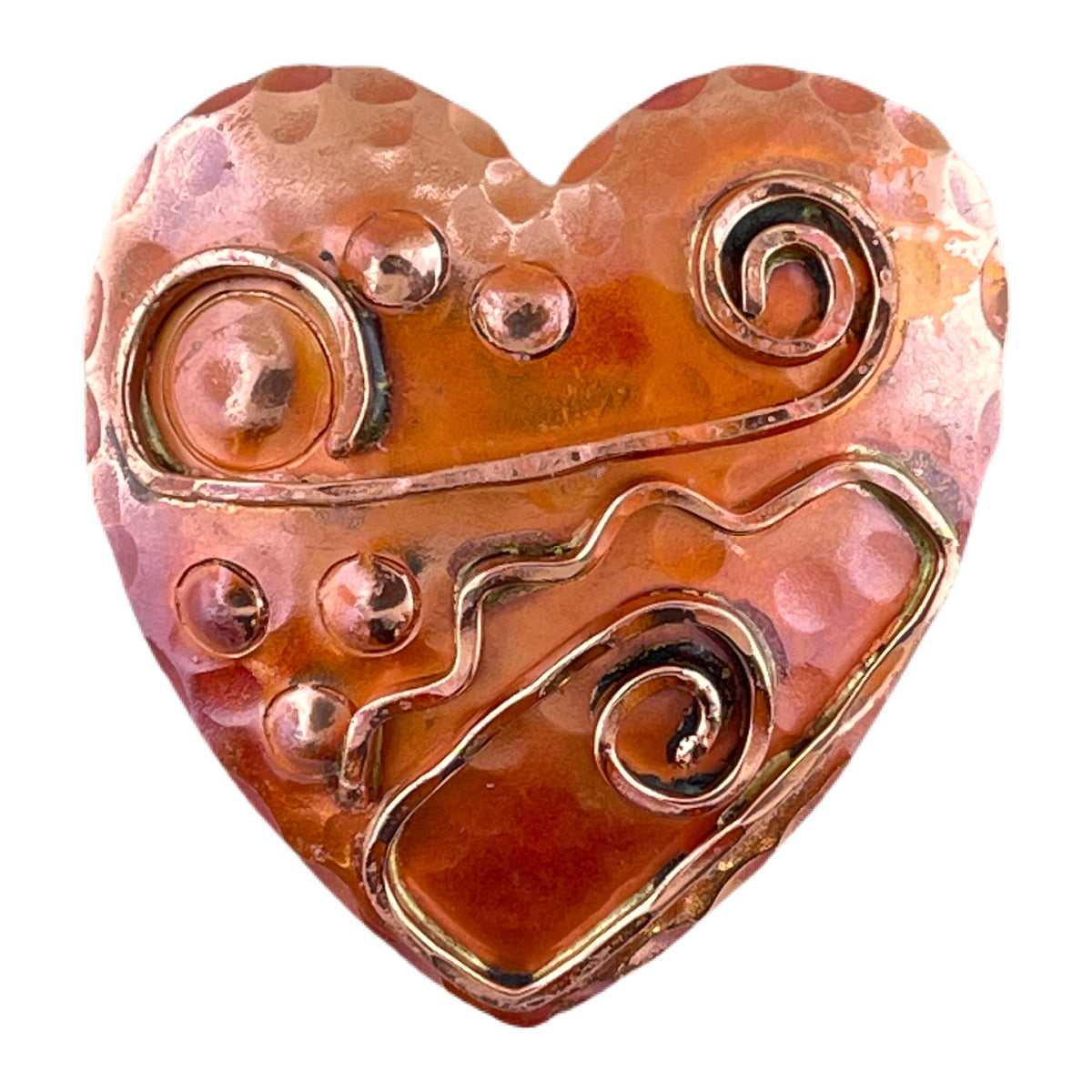 Art Deco-inspired copper heart pendant with hammered wire detail, brass accents, and flame-fired red patina, handcrafted by Patricia Healey.