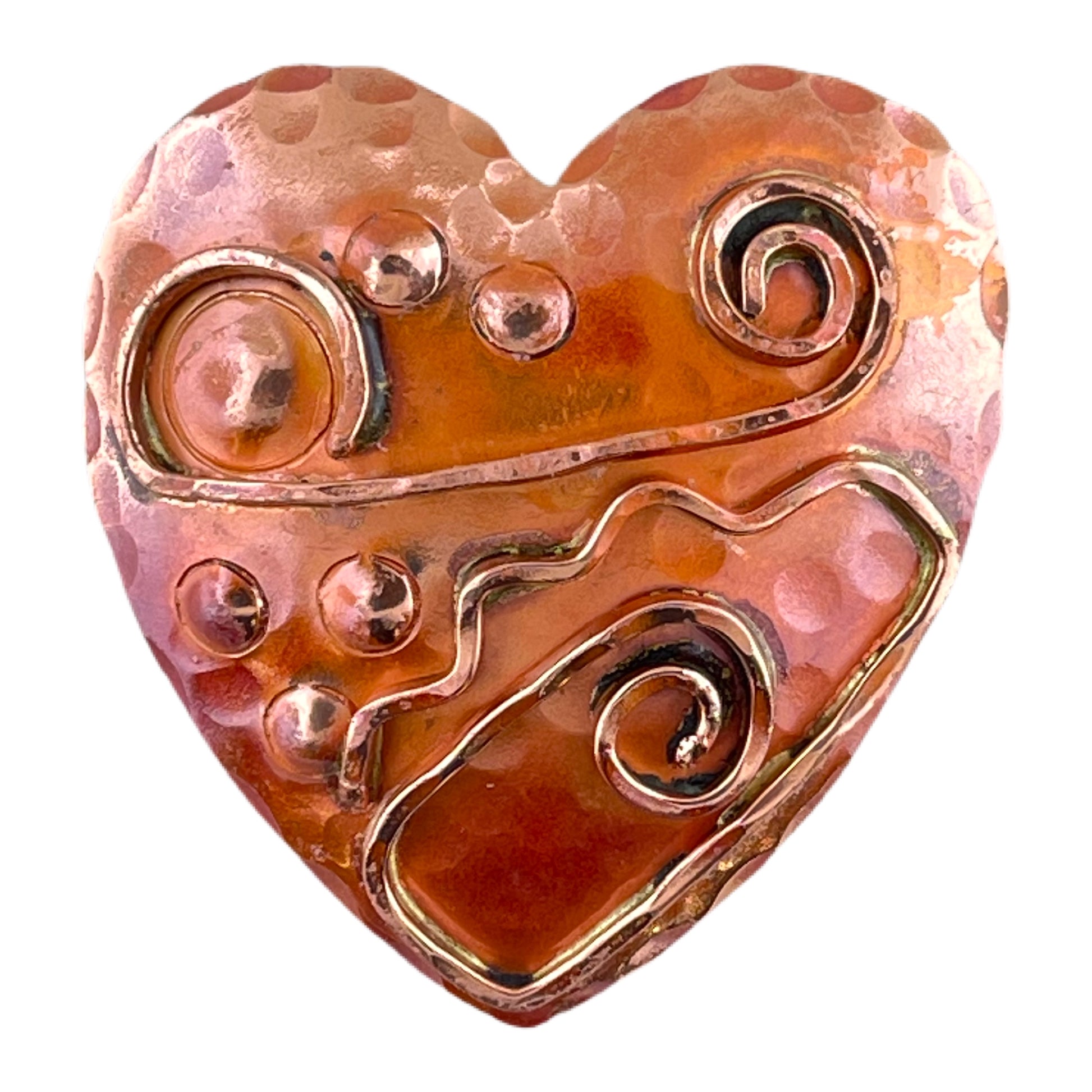 Art Deco-inspired copper heart pendant with hammered wire detail, brass accents, and flame-fired red patina, handcrafted by Patricia Healey.