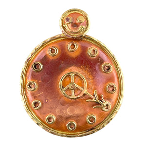 Copper clock pendant with happy face and 4:20 detail, brass accents, and flame-fired red-orange tones. Handcrafted by Patricia Healey.