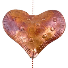 Large copper heart bead with hand stamping and vertical stringing in red-orange patina
