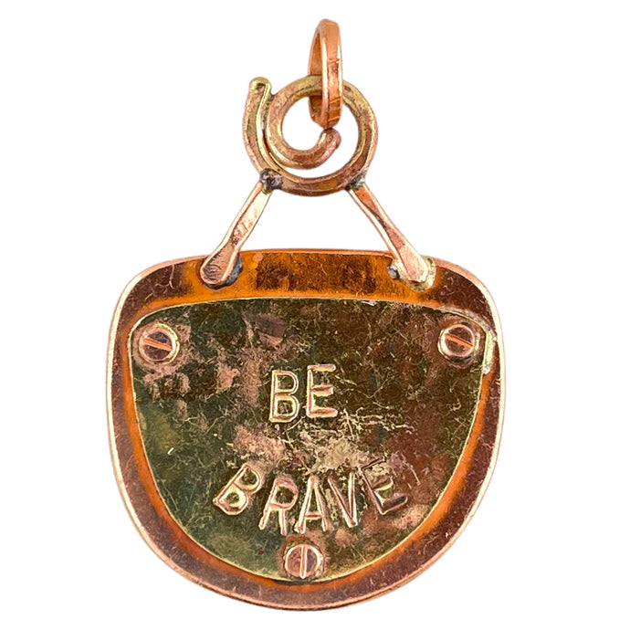 Handmade copper pendant with wild-haired lady on one side and BE BRAVE stamped on the other, by Patricia Healey