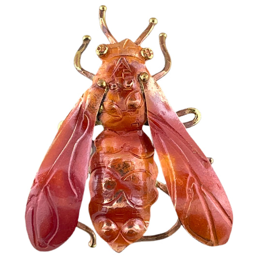 Handcrafted copper bee pendant with angled bail, stamped details, and flame patina