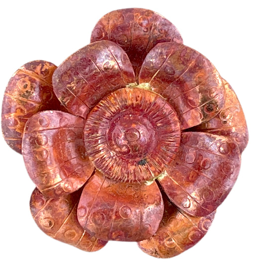 Handmade copper flower pendant with three repoussé layers, stamped texture, and red-orange flame patina by Patricia Healey