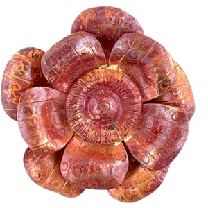 Handmade copper flower pendant with three repoussé layers, stamped texture, and red-orange flame patina by Patricia Healey
