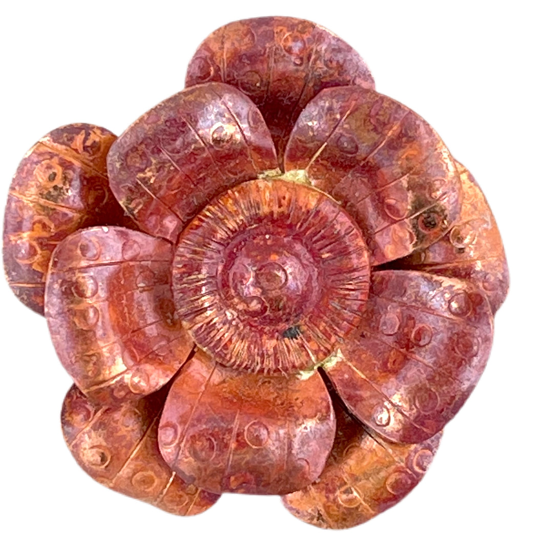 Handmade copper flower pendant with three repoussé layers, stamped texture, and red-orange flame patina by Patricia Healey